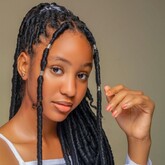 A photo of an African girl facing sided front