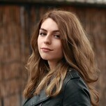 A photo of a brunette girl facing sided front