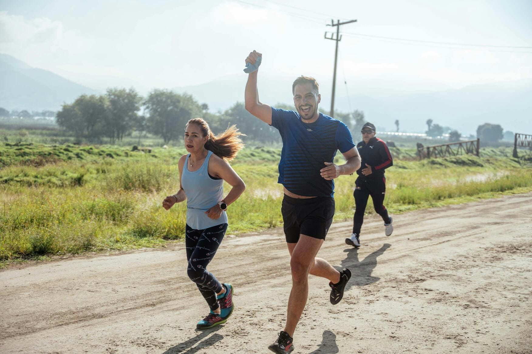 a group of people running doing a road work.